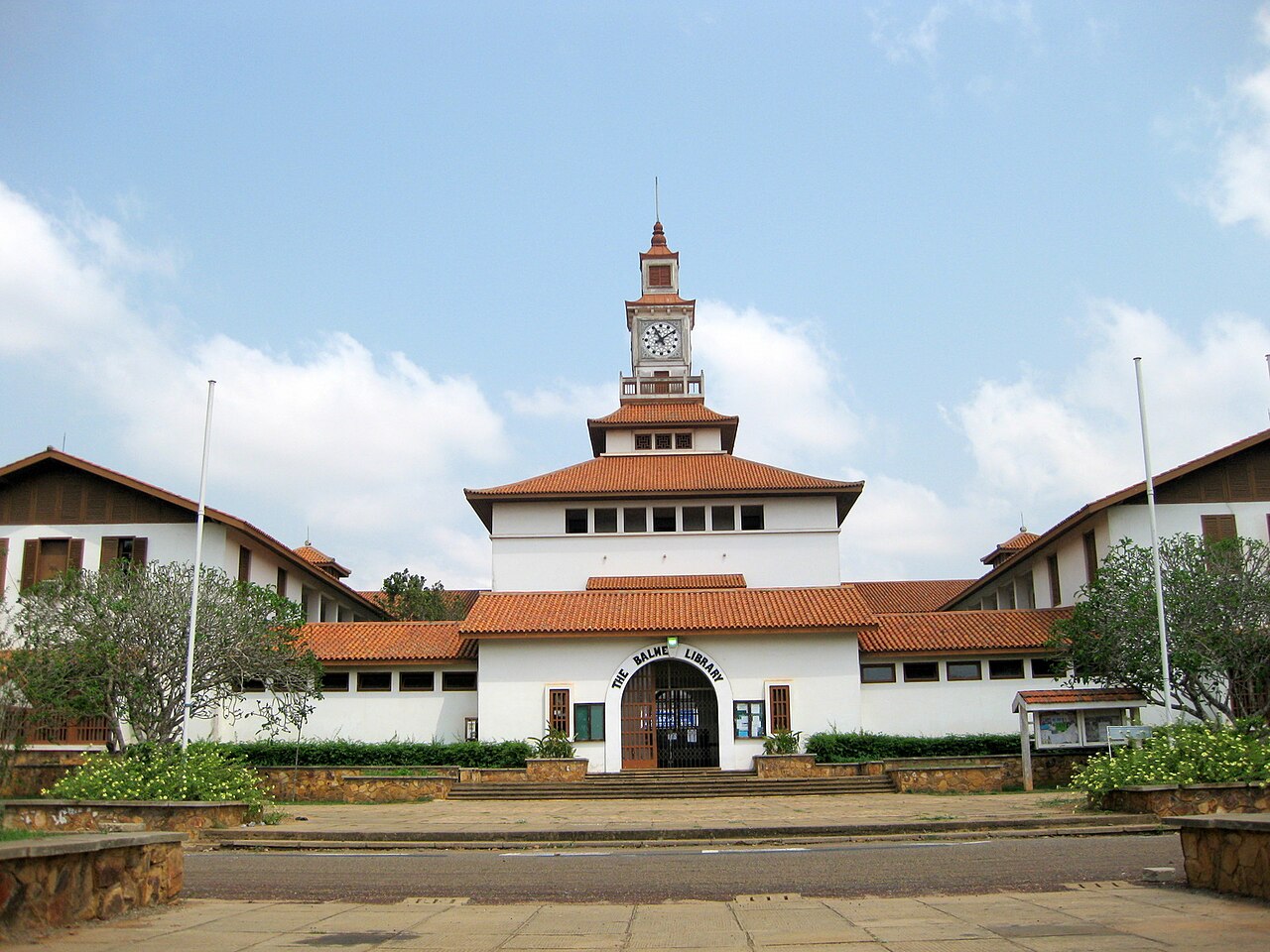 The Balme Library at the University of Ghana, a white building with red tiled roofs and a central clock tower